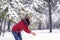 Girl playing with snow on winter day.Wintertime. Happy holiday