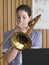 Girl Playing Trombone In Music Class