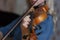 Girl playing the violin. Hand of a girl and a fiddle.