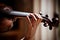 Girl playing violin, holding fingerboard