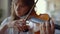 Girl playing violin at home. Violinist playing chords on musical instrument