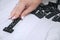 Girl plays dominoes. Dominoes in a wooden box close-up on a gray table.