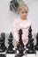 The girl plays interactive chess