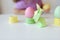 The girl plays with multi-colored eggs with rabbits of origami