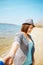 Girl plays on the sea beach