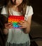 Girl plays with simple dimple toy.