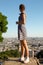 Girl in pois dress watch Paris panorama from Montmartre