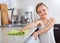 Girl polishing table top at home