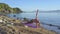 Girl with Ponytail in Yoga Pose against Seascape in Morning