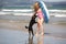 Girl and poodle at beach