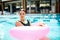 Girl in pool buoy
