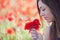 Girl with poppies bunch