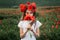 Girl among a poppy field