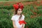 Girl among a poppy field