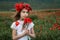 Girl among a poppy field