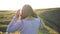 Girl portrait smile emotions in the sunset sunlight beams. Nature hils and field