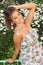 girl pose in on fence in park