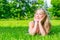 Girl posing lying on the grass