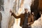 Girl posing near stalactite