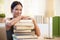 Girl posing with pile of books to learn