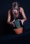 Girl posing in studio with cactus