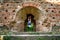 Girl posing in technical ruin. Iron Smelting Plant called Frantiskova Huta in Slovakia