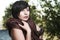 Girl posing in a tree shade