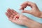 girl pours the last pills into her palm on a light background close-up. vitamins. pharmaceuticals. chemical industry.