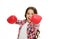 Girl power and feminism concept. Happy kid boxing in gloves isolated on white. Child boxer with long hair boxing for fun