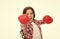 Girl power and feminism concept. Happy kid boxing in gloves isolated on white. Child boxer with long hair boxing for fun