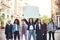 Girl power. Group of young women standing on the road during protest march. Young woman holding blank signboard over her