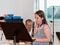 Girl practicing flute playing at a lesson in the music class in