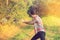 Girl practicing tai chi in the nature outdoor during sunny day