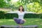 A girl is practicing yoga and looking healthy. The good-looking lady in leggings doing asanas. Balance and health concept.