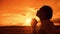 The girl prays. Girl folded her hands in prayer lifestyle silhouette at sunset. slow motion video. Girl folded her hands