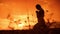 The girl prays. Girl folded her hands in prayer silhouette at sunset. slow motion video. Girl folded her hands in prayer