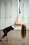 Girl preapring for Aerial yoga practicing - anti gravity with scarves
