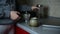 A girl prepare coffee espresso with italian moka in the kitchen, morning coffee