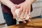 The girl prepares pies at home in the kitchen. Dough in the hands of a girl close-up