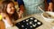 Girl preparing cookie with grandmother in kitchen 4k