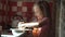 Girl preparing dough in bowl.