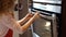 Girl preparing food in oven