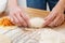 Girl preparing vegetarian pies with filling at home in the kitchen close-up