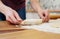 Girl preparing vegetarian pies with filling at home in the kitchen close-up