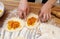 Girl preparing vegetarian pies with filling at home in the kitchen close-up