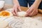 Girl preparing vegetarian pies with filling at home in the kitchen close-up