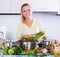 Girl preparing veggie lunch at home kitchen