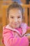 Girl-preschooler sitting at table