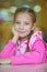 Girl-preschooler sitting at table