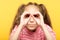 Girl pretending look binoculars hands search